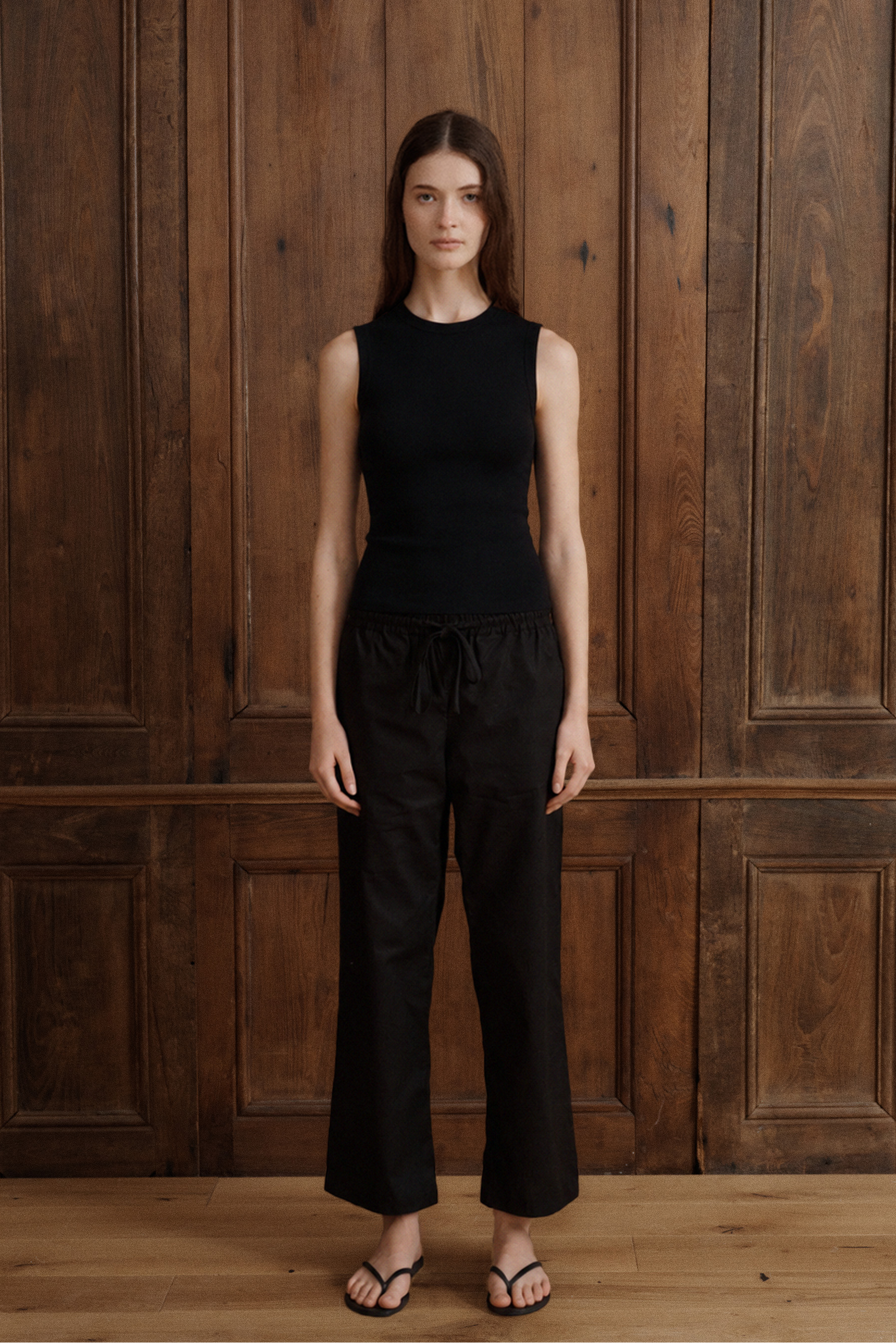 Women’s black Supima cotton tank with a slim fit and minimalist high neckline. - VIR VITA
#color_black