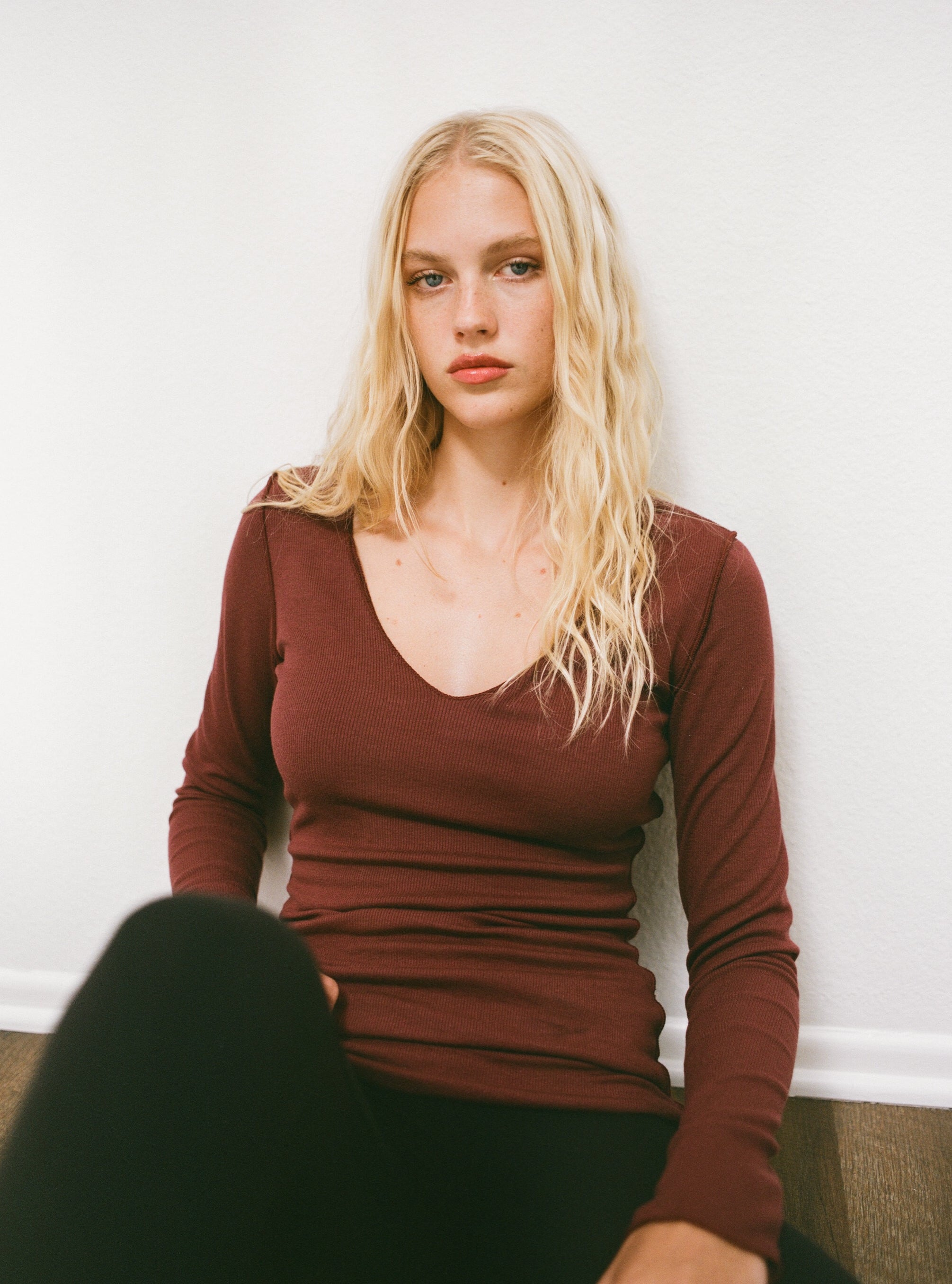 Female model wearing sustainable micro modal maroon buttery soft double lined v neck long sleeve ribbed top. Classic, timeless, elegant, french style. natural organic clothing- VIR VITA
#color_maroon