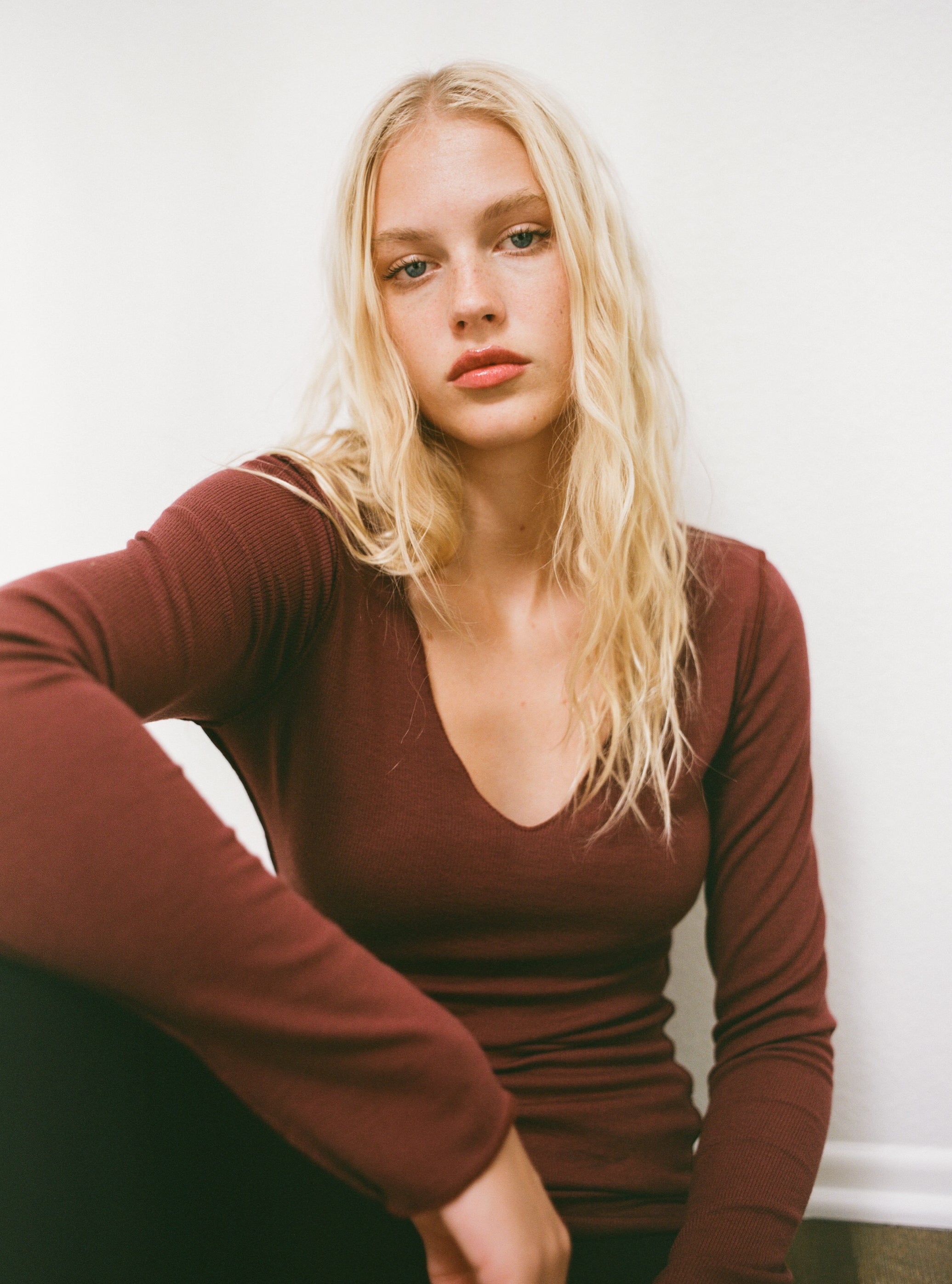 Female model wearing sustainable micro modal maroon buttery soft double lined v neck long sleeve ribbed top. Classic, timeless, elegant, french style. natural organic clothing- VIR VITA
#color_maroon