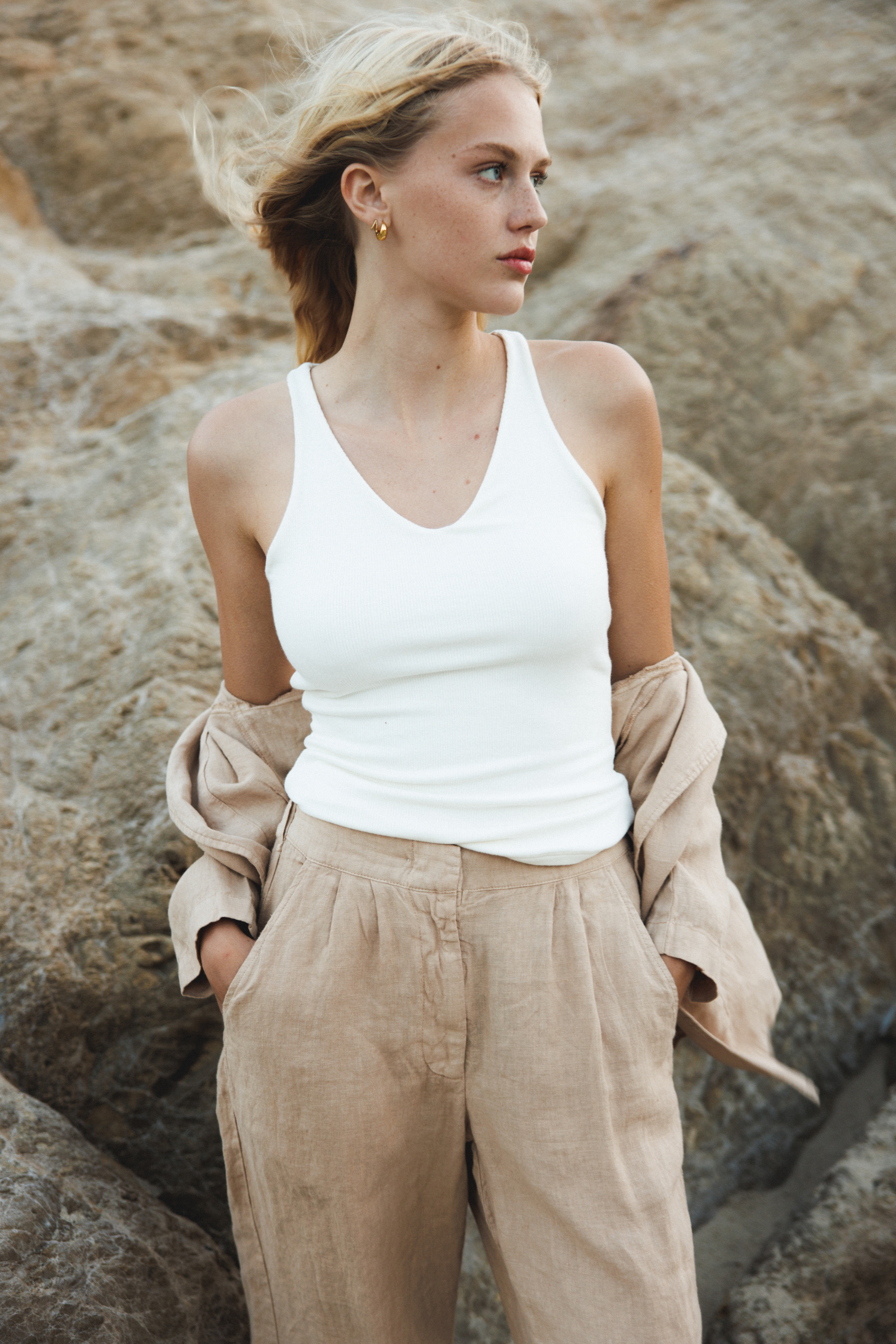 Female model wearing white sustainable micro modal ribbed double lined tank top with unique U neckline. Classic, timeless, elegant, french style. Natural organic clothing - VIR VITA
#color_coconut