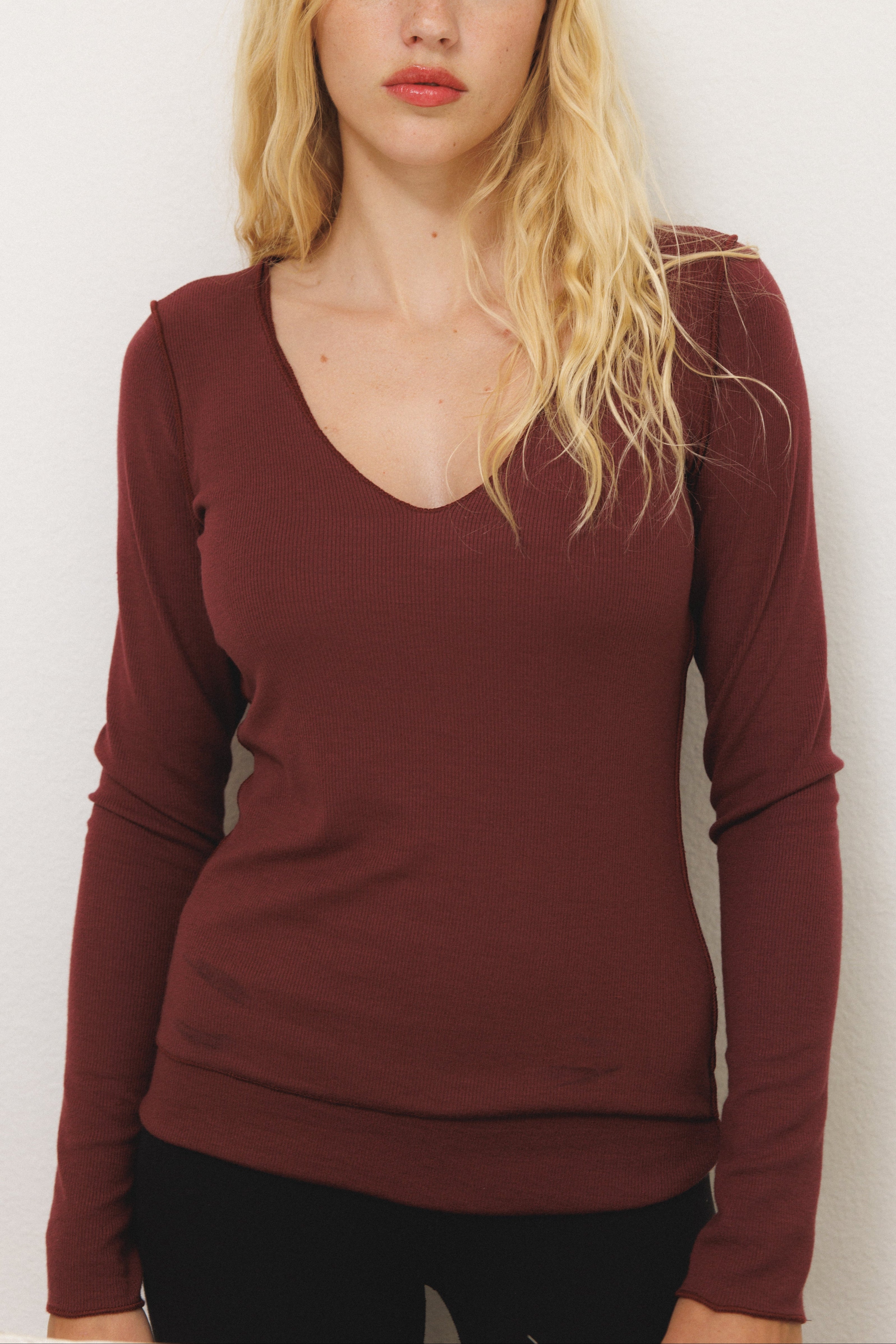 Female model wearing sustainable micro modal maroon buttery soft double lined v neck long sleeve ribbed top. Classic, timeless, elegant, french style. natural organic clothing- VIR VITA
#color_maroon