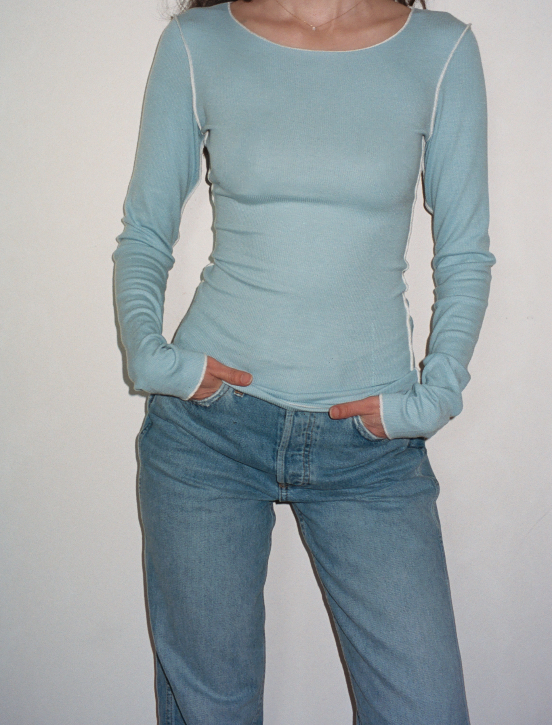 Female model wearing baby blue sustainable micro modal long sleeve with merrow stitch detailing. Classic, timeless, elegant, french style. Natural organic clothing - VIR VITA

#color_baby blue