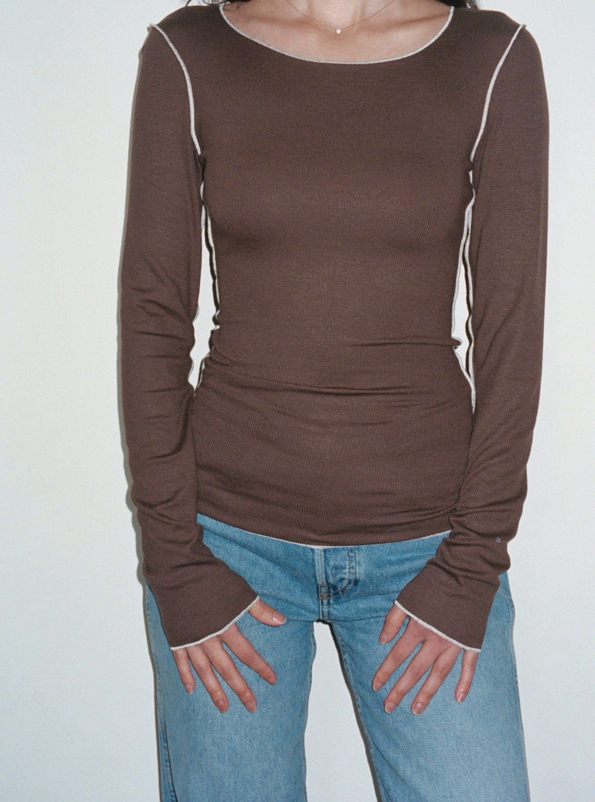 Female model wearing brown sustainable micro modal long sleeve with merrow stitch detailing and jeans. Classic, timeless, elegant, french style. Natural organic clothing - VIR VITA

#color_chestnut