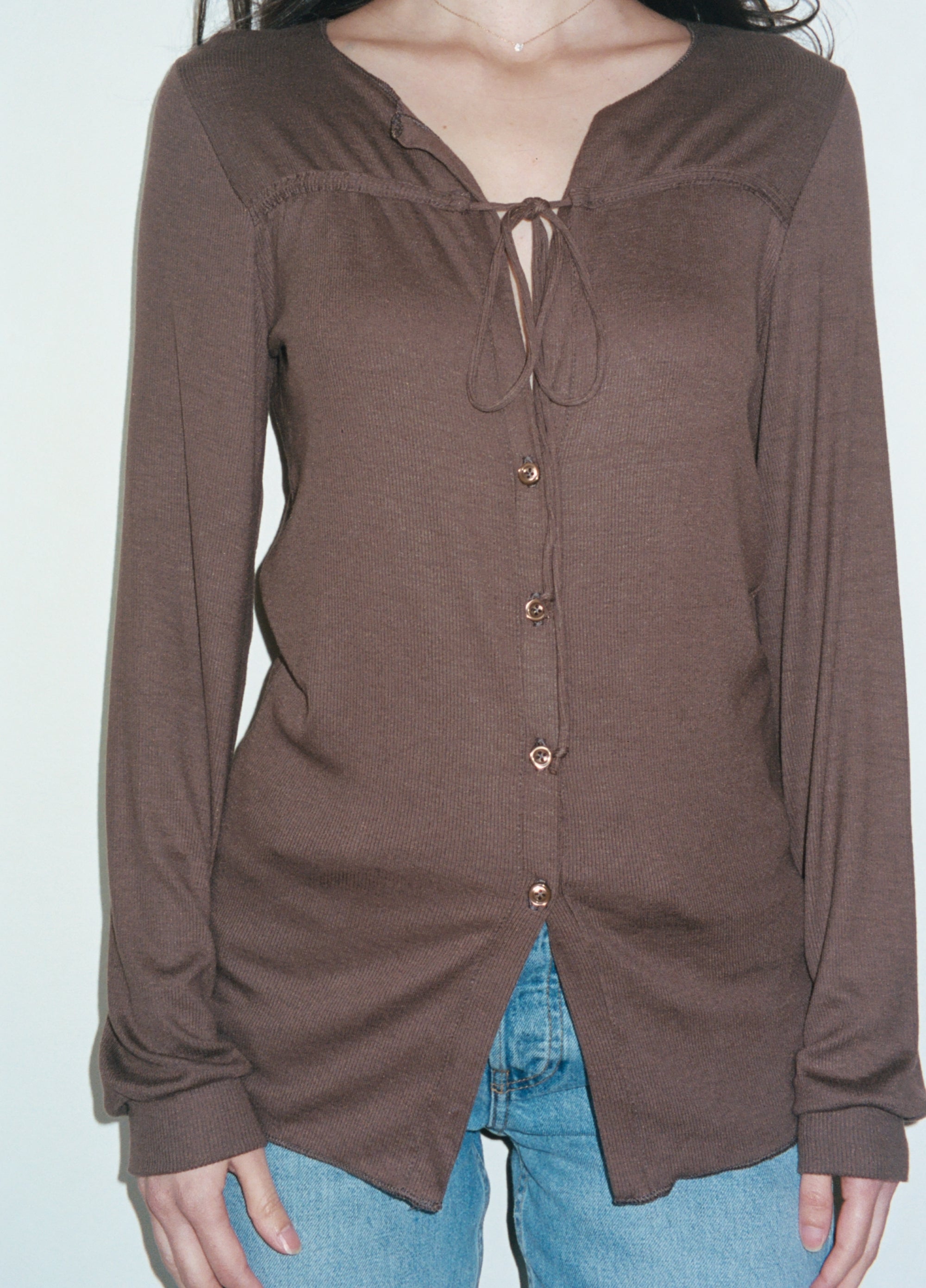 Female model wearing sustainable micro modal brown buttery soft long sleeve ribbed top with tie and italian button. Romantic top. Classic, timeless, elegant, french style. natural organic clothing- VIR VITA

#color_chestnut