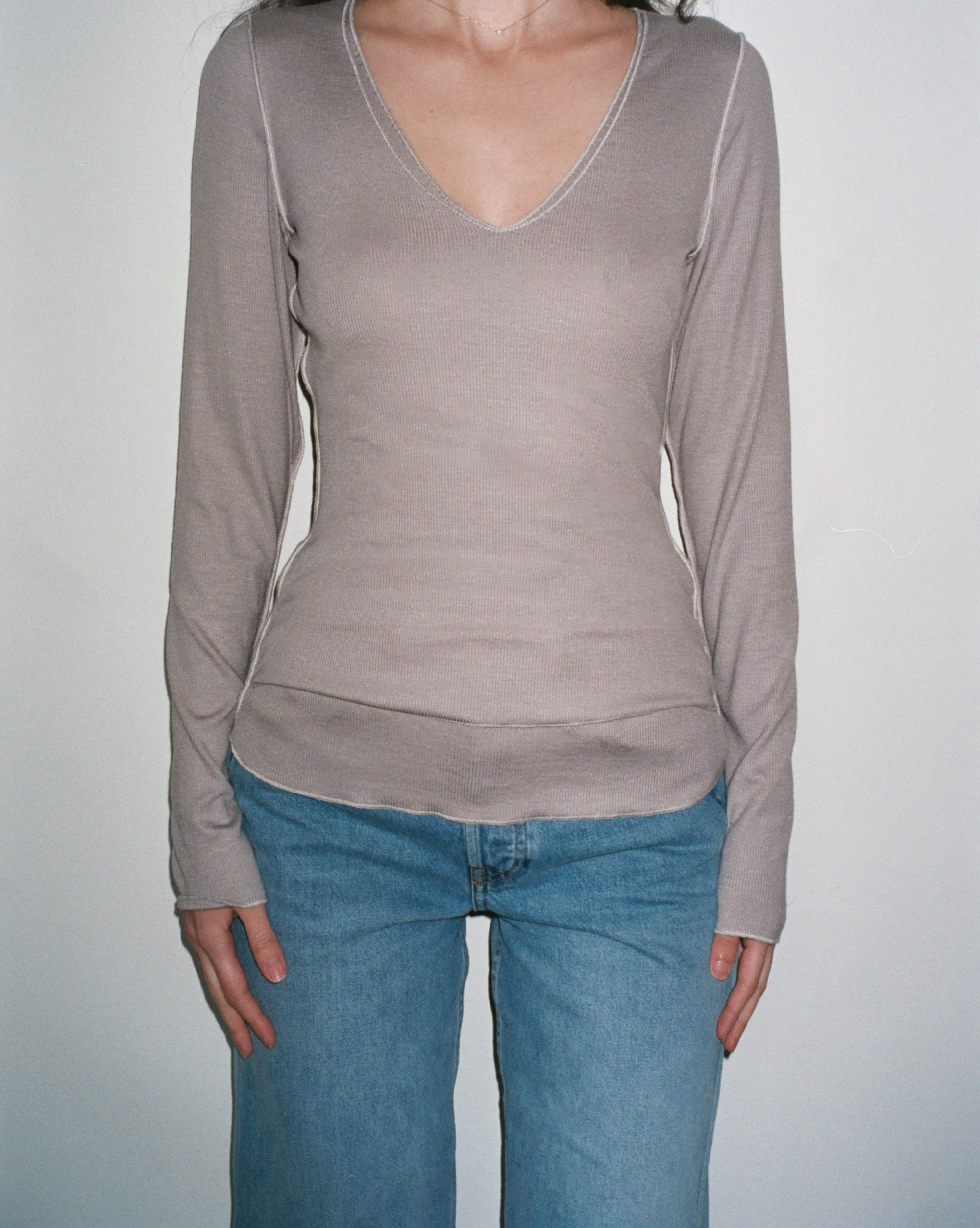 Female model wearing sustainable micro modal grey buttery soft double lined v neck long sleeve ribbed top. Classic, timeless, elegant, french style. natural organic clothing- VIR VITA

#color_grey