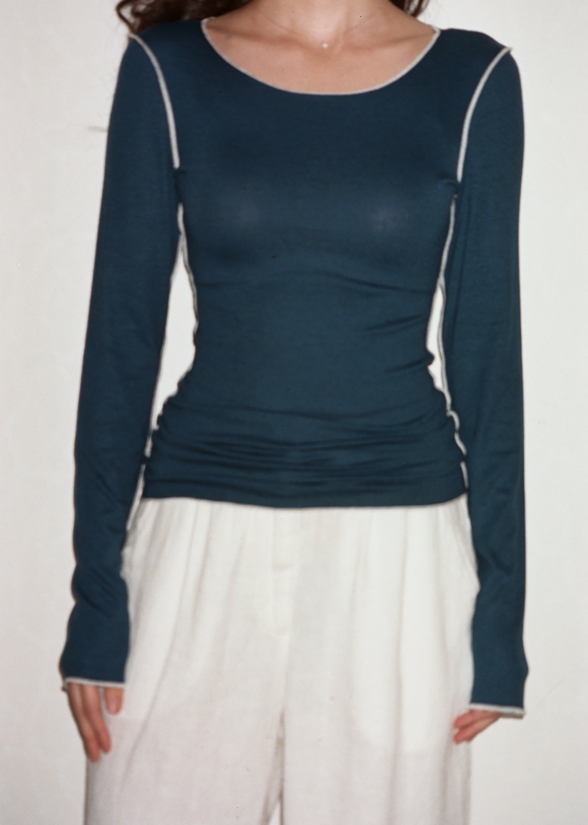 Female model wearing navy sustainable micro modal long sleeve with merrow stitch detailing. Classic, timeless, elegant, french style. Natural organic clothing - VIR VITA

#color_navy