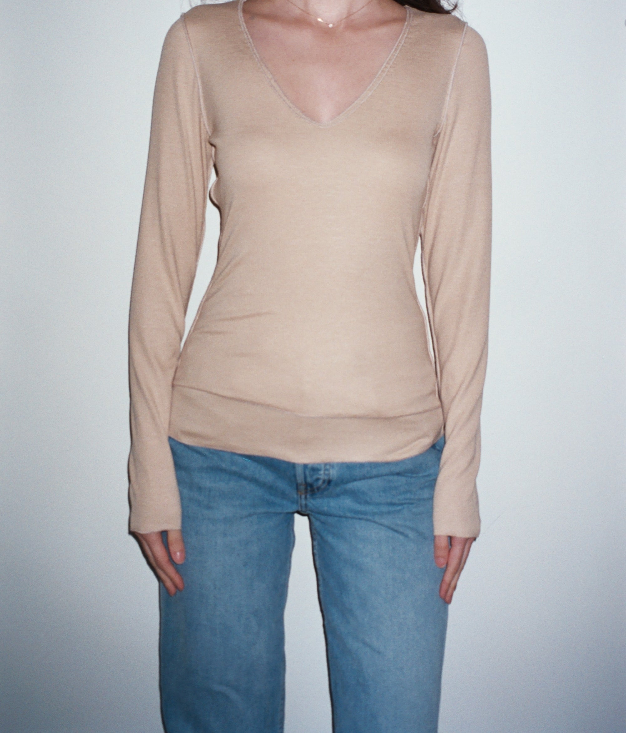 Female model wearing sustainable micro modal cream buttery soft double lined v neck long sleeve ribbed top. Classic, timeless, elegant, french style. natural organic clothing- VIR VITA
#color_toffee