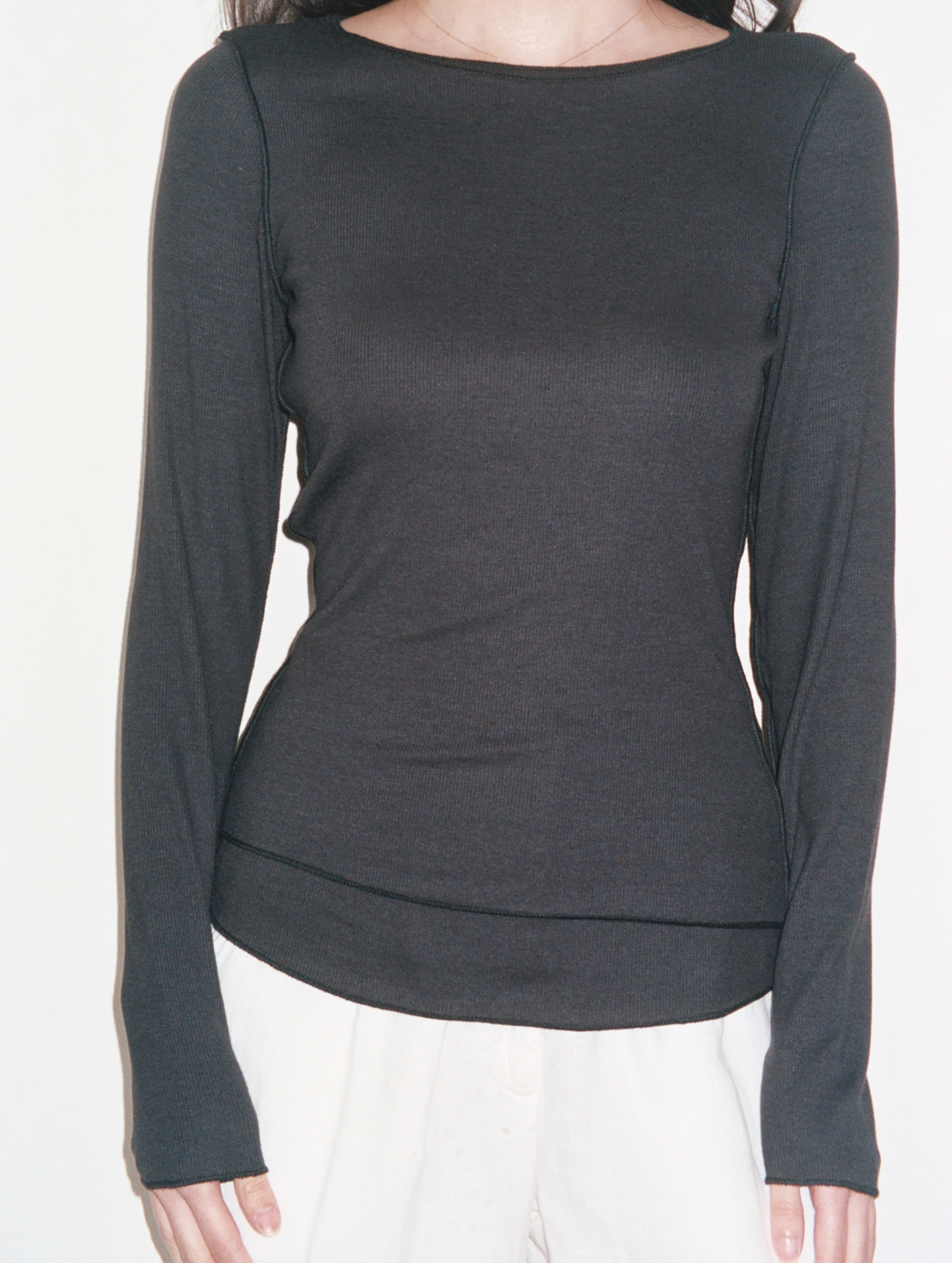 Female model wearing sustainable micro modal black buttery soft double lined long sleeve ribbed top. Classic, timeless, elegant, french style. natural organic clothing- VIR VITA


#color_black