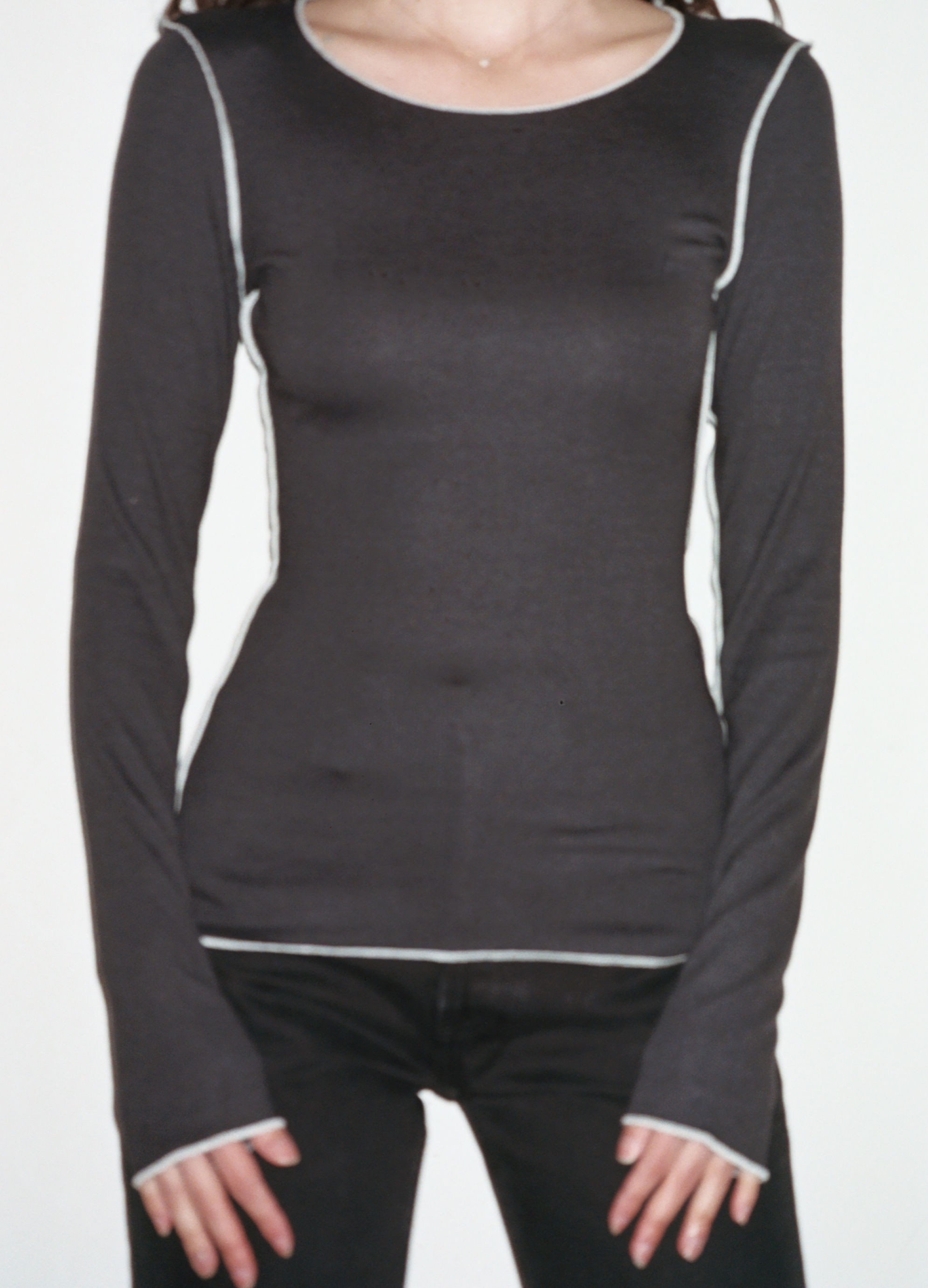 Female model wearing black sustainable micro modal long sleeve with merrow stitch detailing. Classic, timeless, elegant, french style. Natural organic clothing - VIR VITA

#color_black