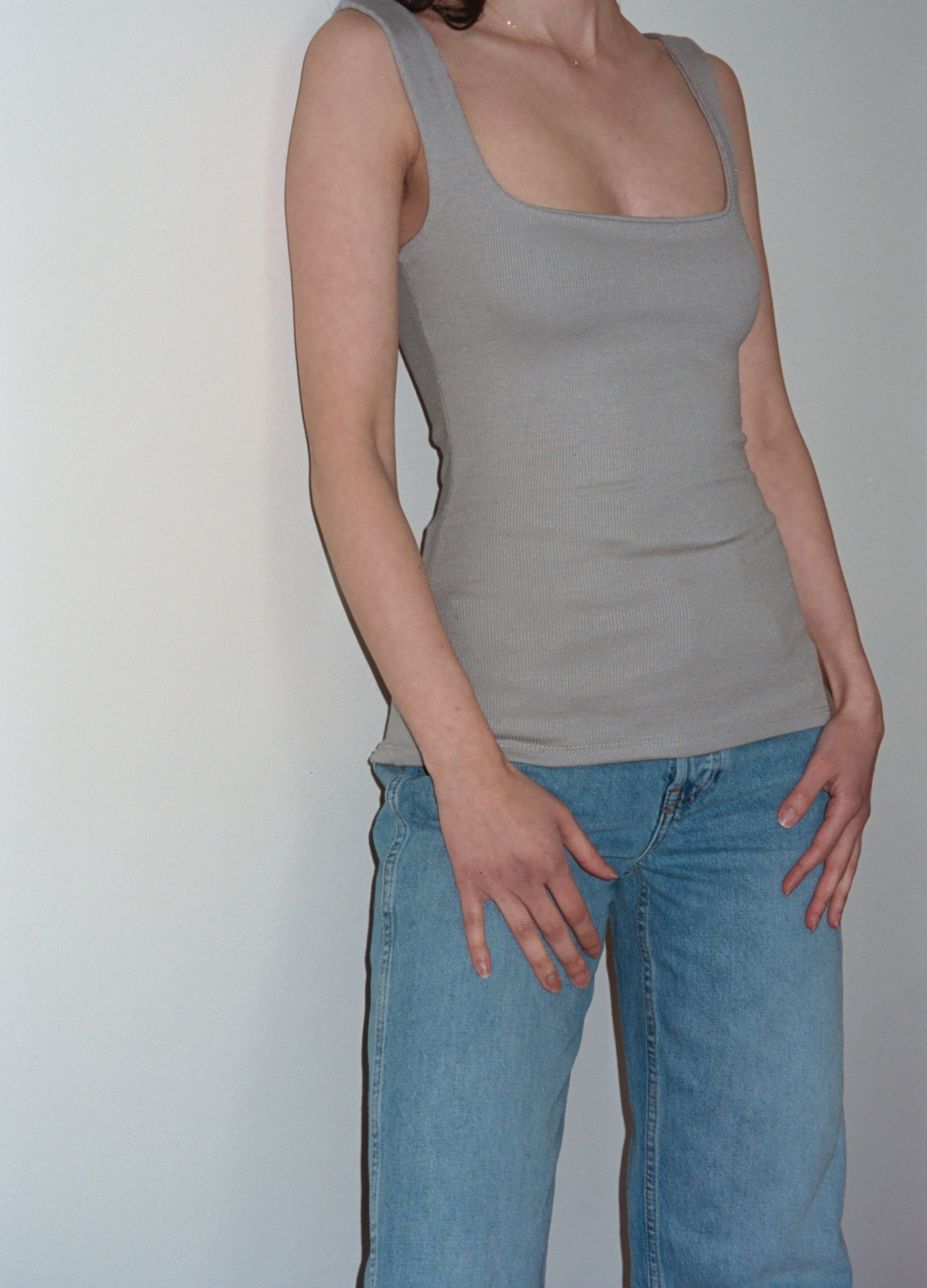 
Female model wearing grey square neck top inspired by 90s style - VIR VITA

#color_grey 