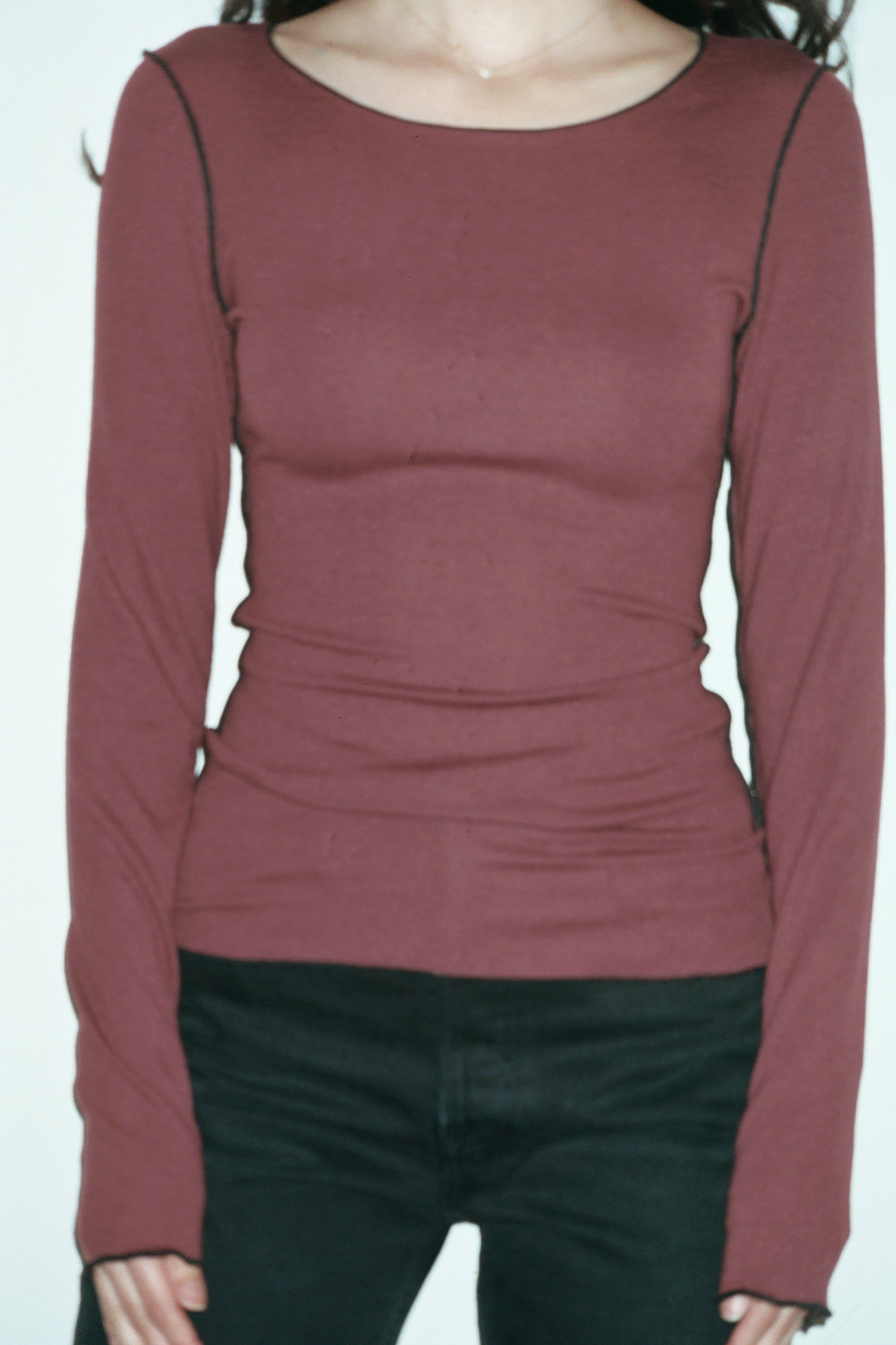 Female model wearing maroon sustainable micro modal long sleeve with merrow stitch detailing. Classic, timeless, elegant, french style. Natural organic clothing - VIR VITA

#color_maroon