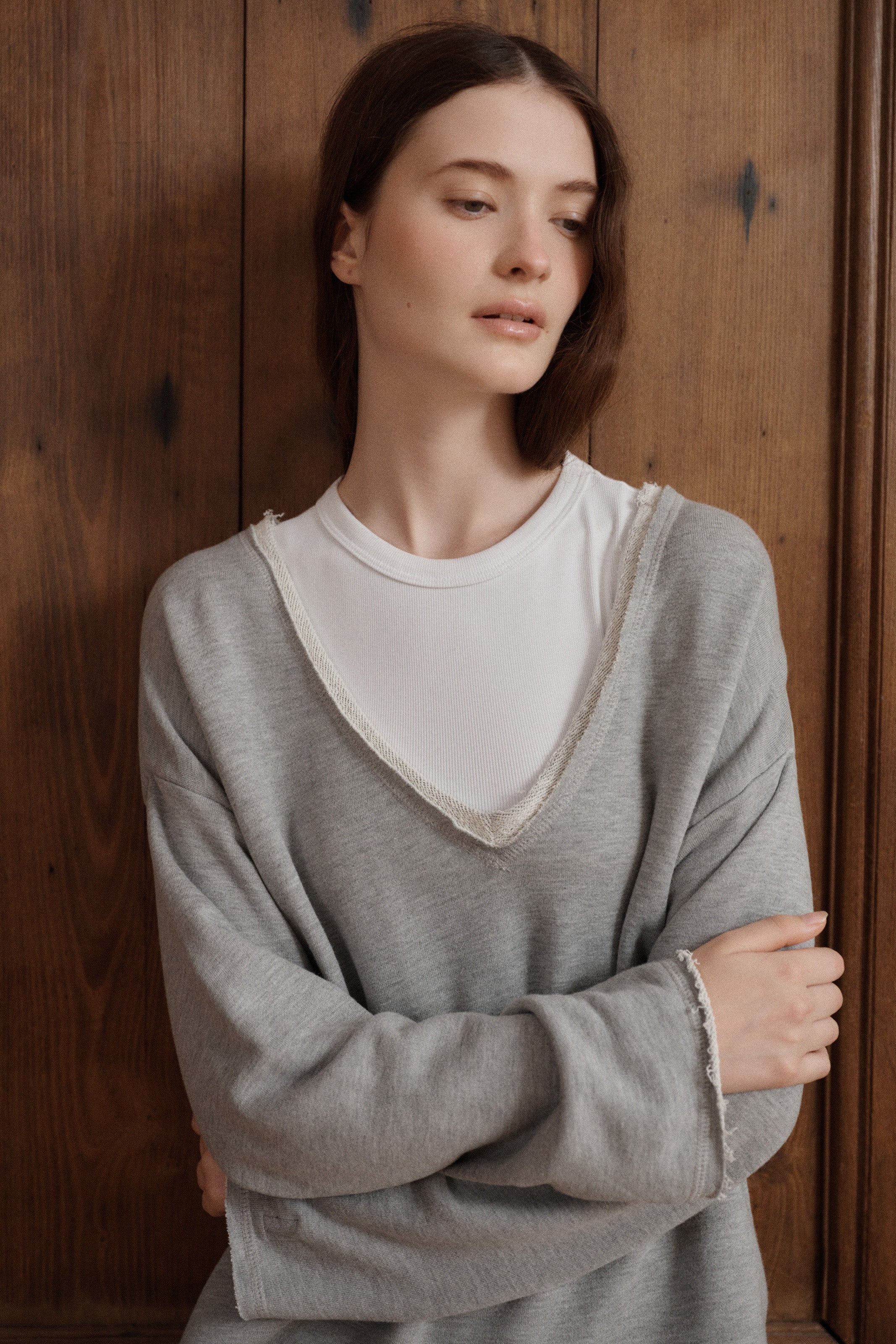 Relaxed heather grey V-neck sweatshirt crafted from soft cotton with a casual raw-edge finish. - VIR VITA
#color_heather grey