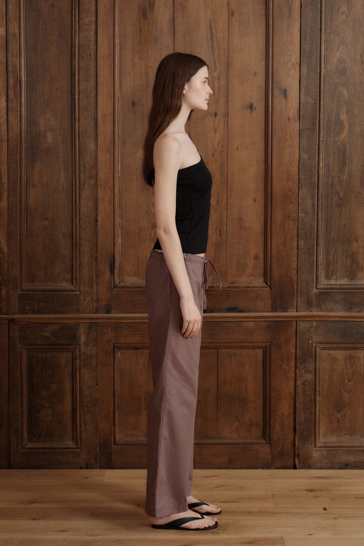 Black fitted one-shoulder tank top with a diagonal neckline and soft ribbed texture. - VIR VITA
#color_Black