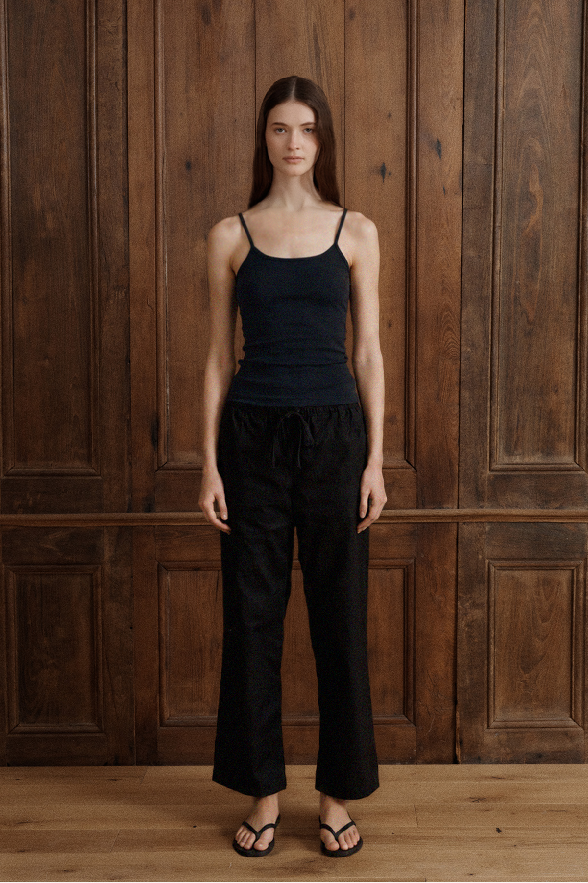Black modal rib cami with delicate straps, a scoop neckline, and fitted silhouette.- VIR VITA
#color_black
