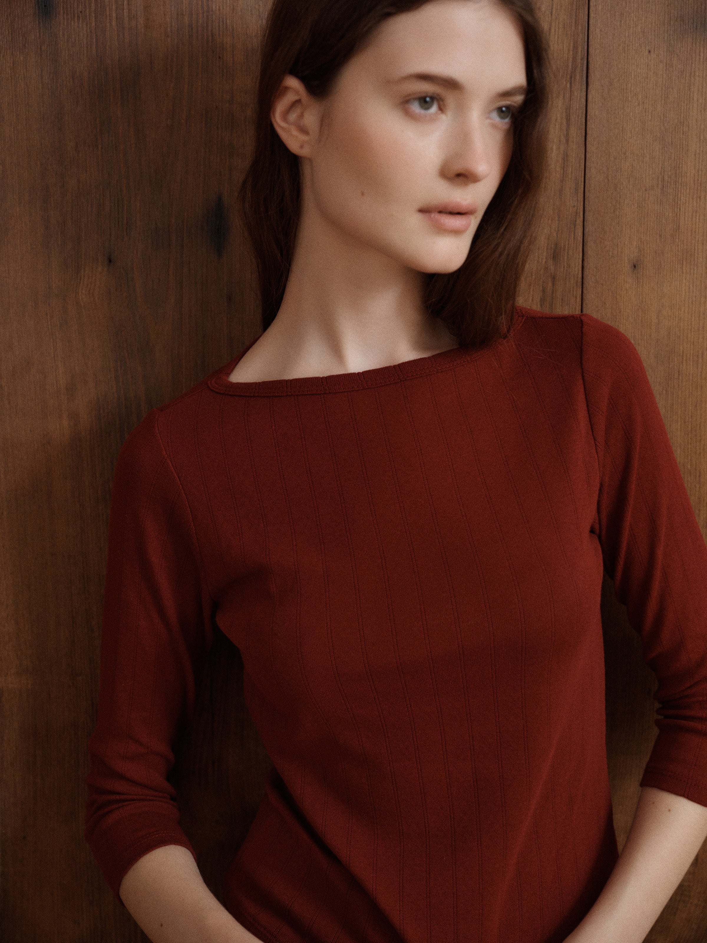 Soft merlot red pointelle knit top with a wide neckline, fitted body, and long sleeves. - VIR VITA
#color_merlot