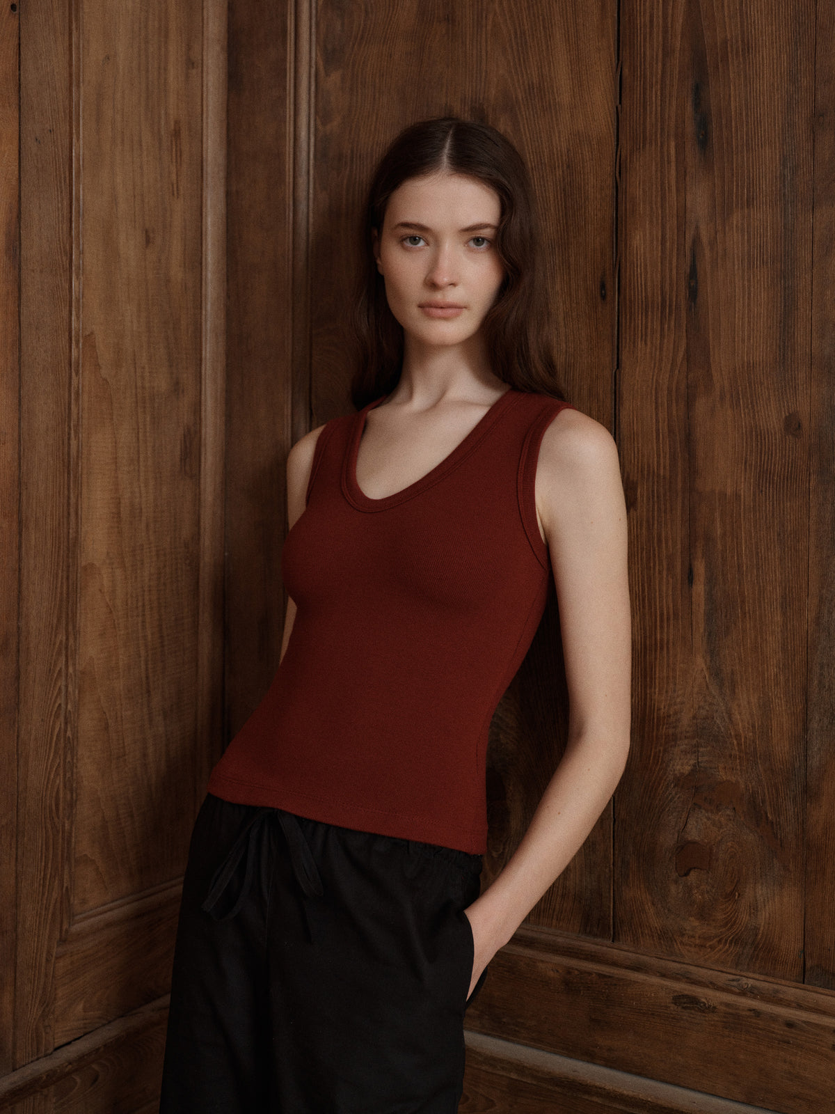 Woman wearing a deep red scoop neck ribbed tank top with black drawstring pants. - VIR VITA
#color_merlot