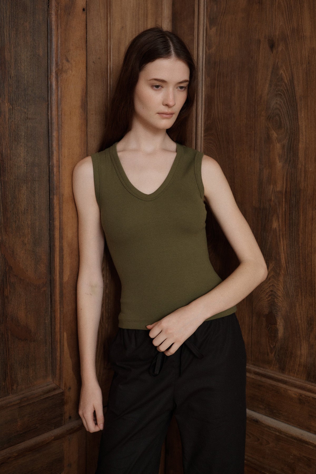 Women’s fitted dark green tank top with a classic shallow scoop neckline. - VIR VITA
#color_moss