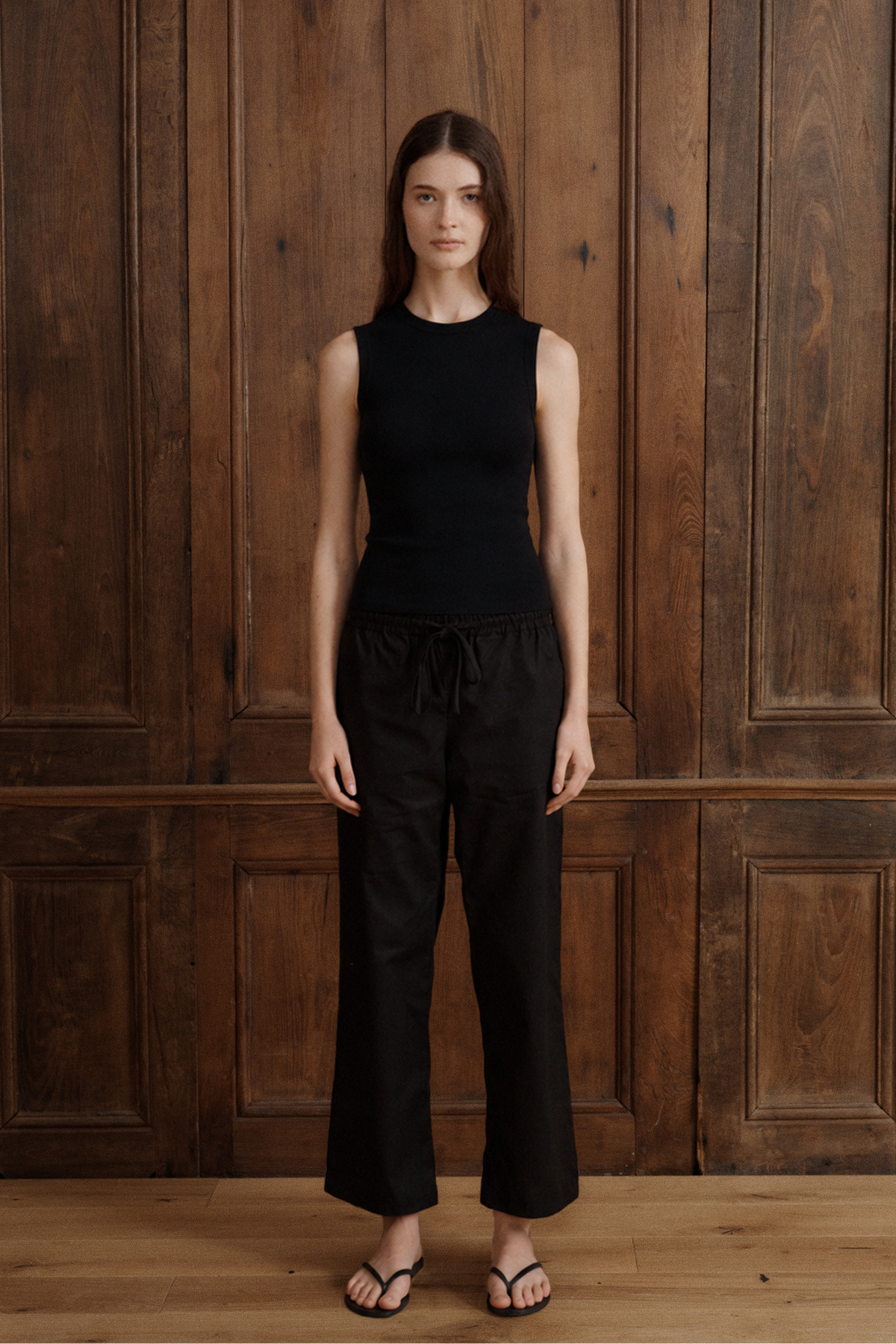 Women’s black Supima cotton tank with a slim fit and minimalist high neckline. - VIR VITA
#color_black