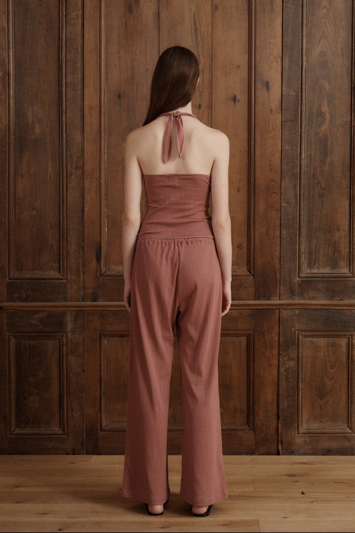 Women’s fitted pointelle cotton halter top in petal pink with adjustable neck ties. -VIR VITA
#color_petal
