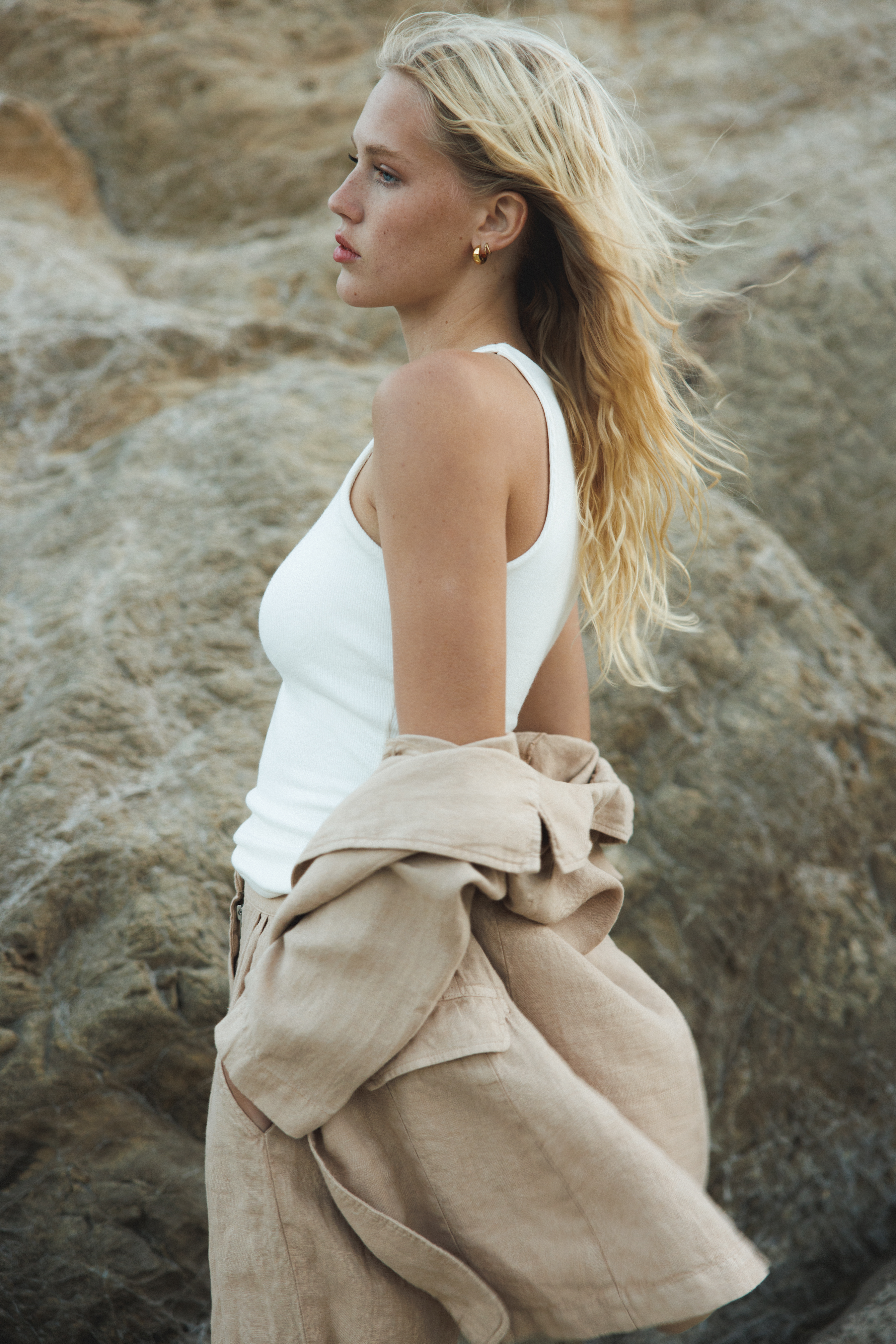 Female model wearing white sustainable micro modal ribbed double lined tank top with unique U neckline. Classic, timeless, elegant, french style. Natural organic clothing - VIR VITA
