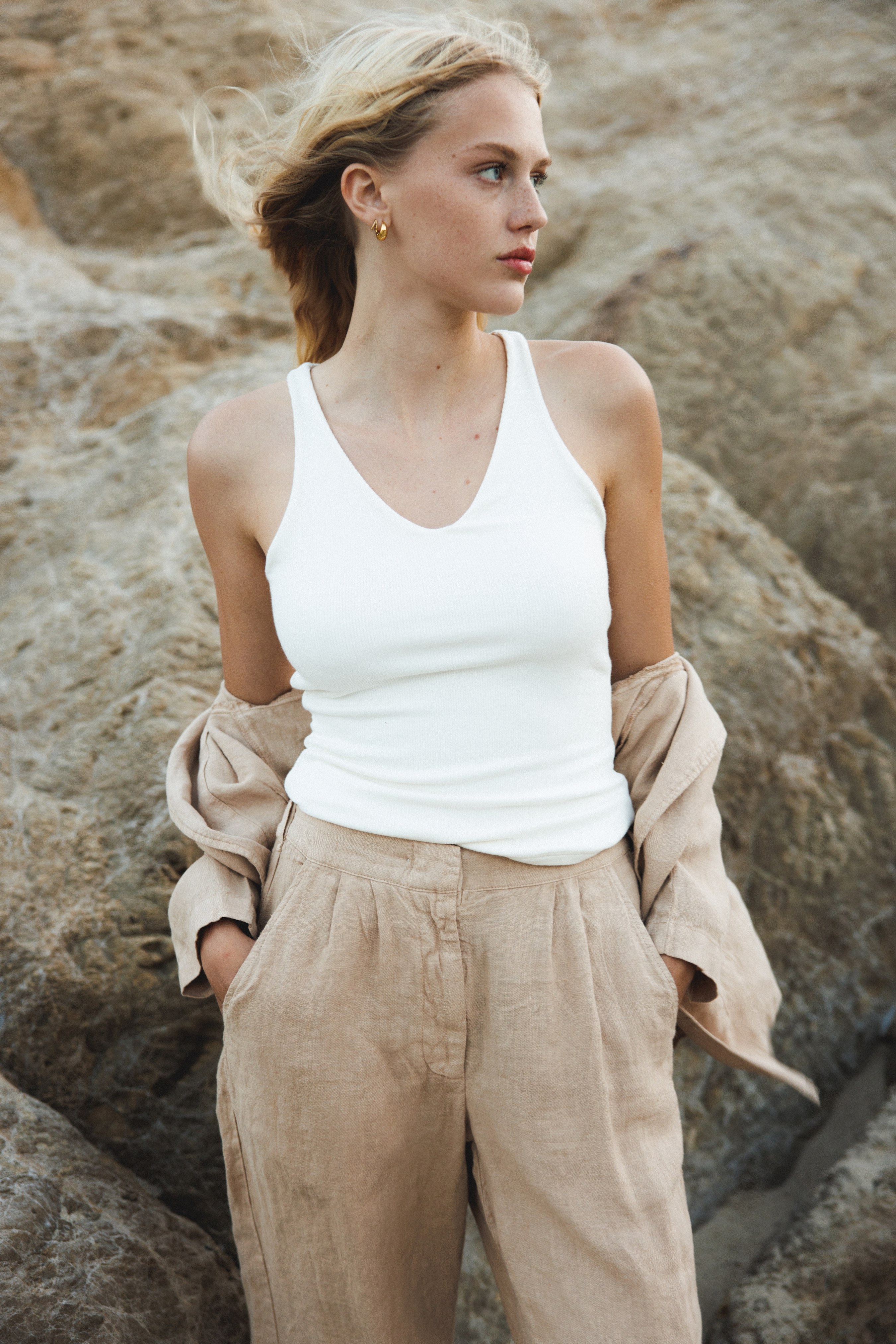 Female model wearing  white sustainable micro modal ribbed double lined tank top with unique U neckline. Classic, timeless, elegant, french style. Natural organic clothing - VIR VITA



