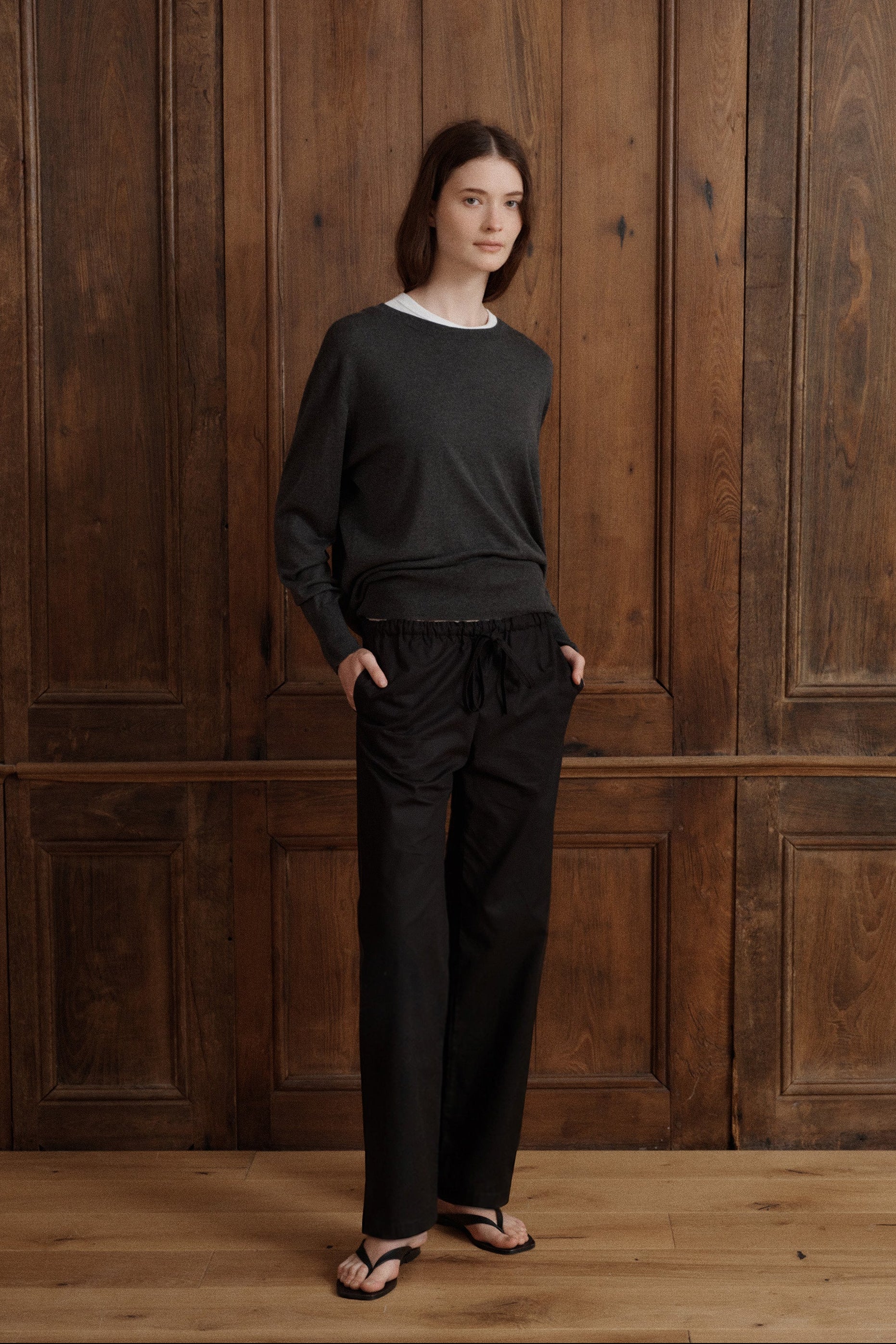 A refined long-sleeve crewneck knit in a deep charcoal grey, finished with ribbed neckline, cuffs, and hem. - VIR VITA
#color_anthracite